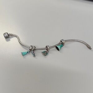 Pandora Bracelet with four Disney charms.